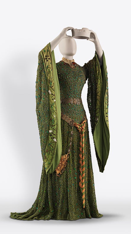 The green sweeping Beetlewing Dress after conservation on a mannequin